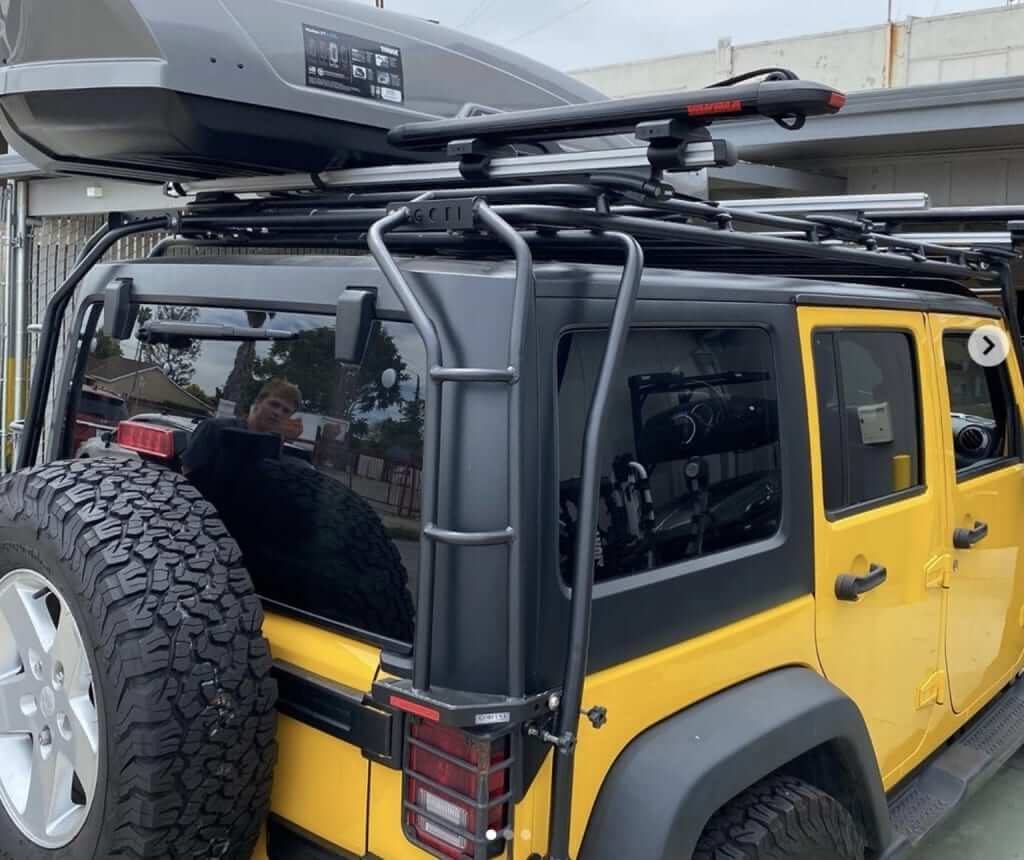 Gobi Stealth Rack with Thule ProBar Evo, Thule Motion Rooftop Cargo Box, & Yakima SupDawg SUP_Surfboard Rack on Jeep Wrangler Rack N Road