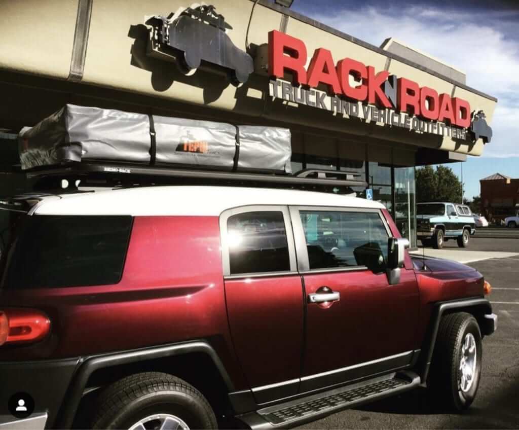 Tepui Rooftop Tent outside Sacramento Store on a Toyota mid-size SUV rack n road
