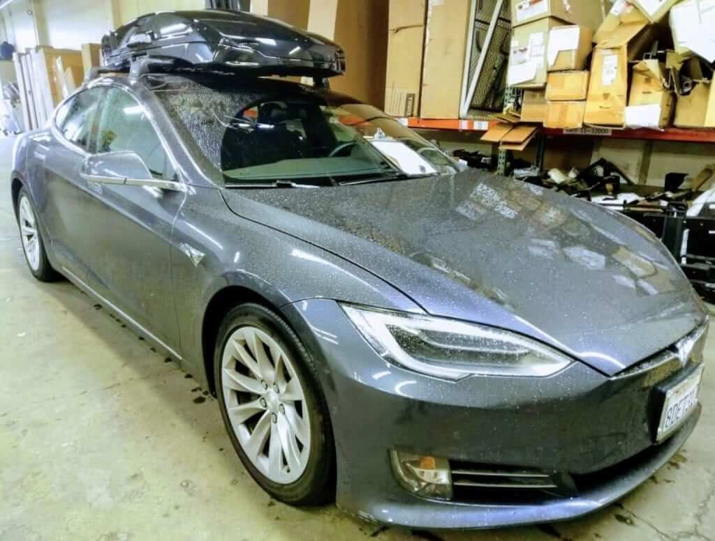 Tesla Model S with Thule AeroBlade Edge Roof Rack & Thule Motion Rooftop Cargo Box Rack N Road