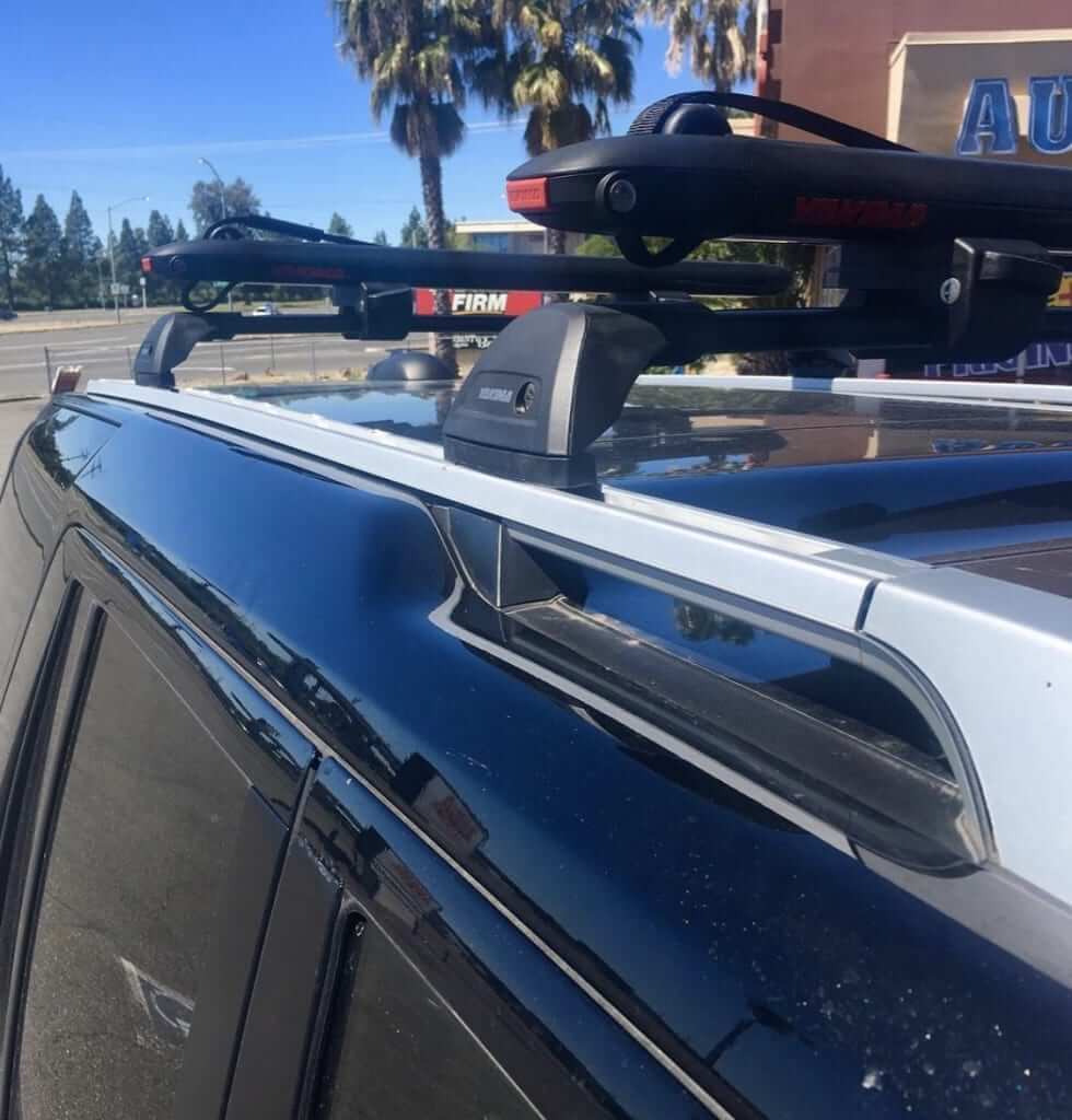 Yakima FlushBar Roof Rack with Yakima SupDawg SUP & Surfboard Rack on a Land Rover LR4 Rack N Road